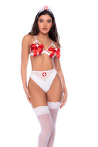 Two-piece set featuring a strappy bra with bow details and a matching panty. Playful and cheeky with a nurse-inspired touch.