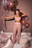 A sophisticated two-piece set in a floral lace. Includes top with adjustable straps and long pants.